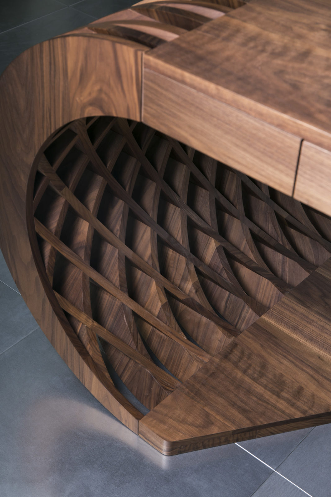 Curved solid walnut desk detail