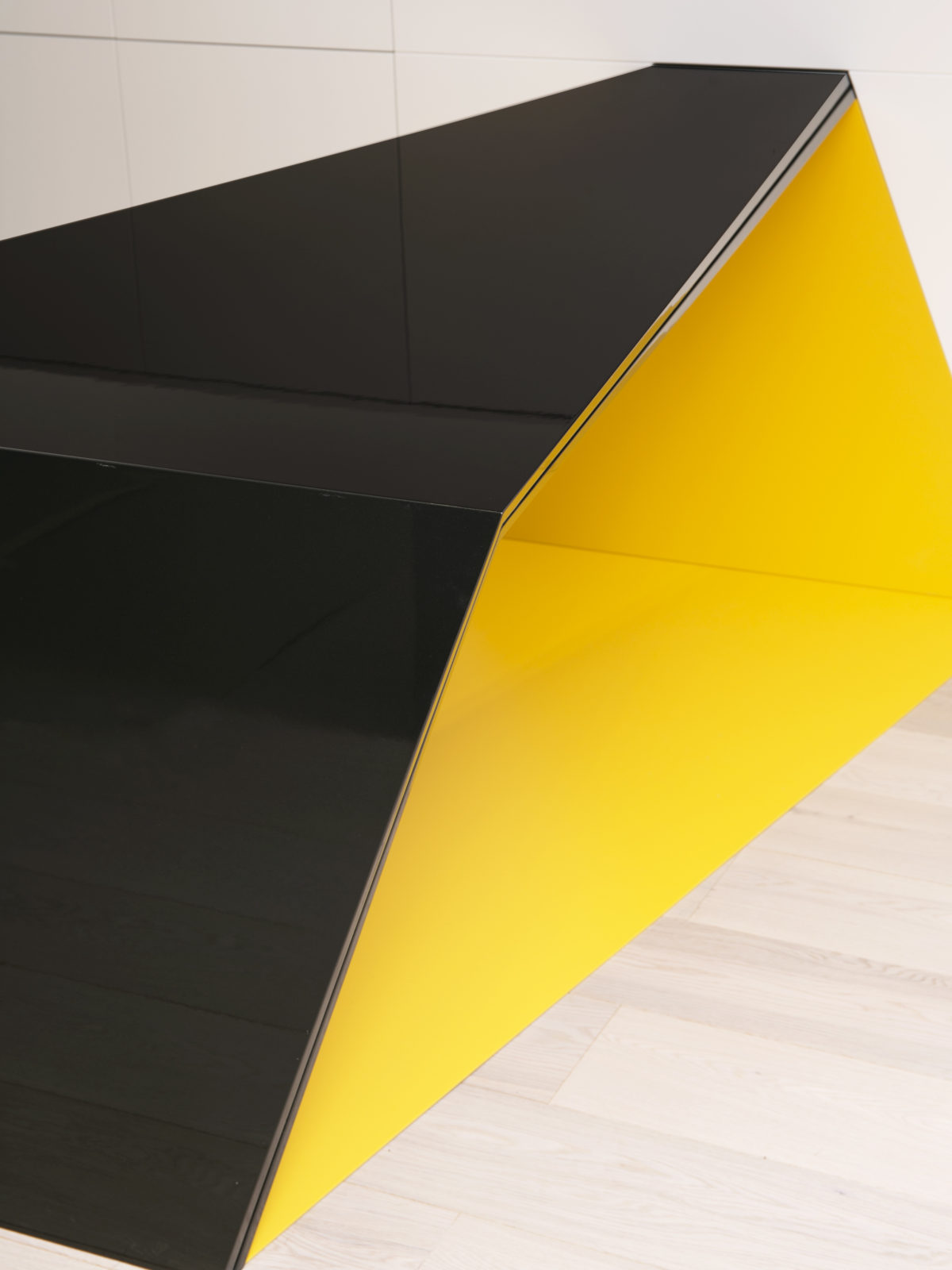 Glossy gun metal lacquered desk with yellow matt lacquered Corian inside