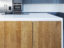 Handless kitchen island with solid oak doors and Antartica Corian worktop