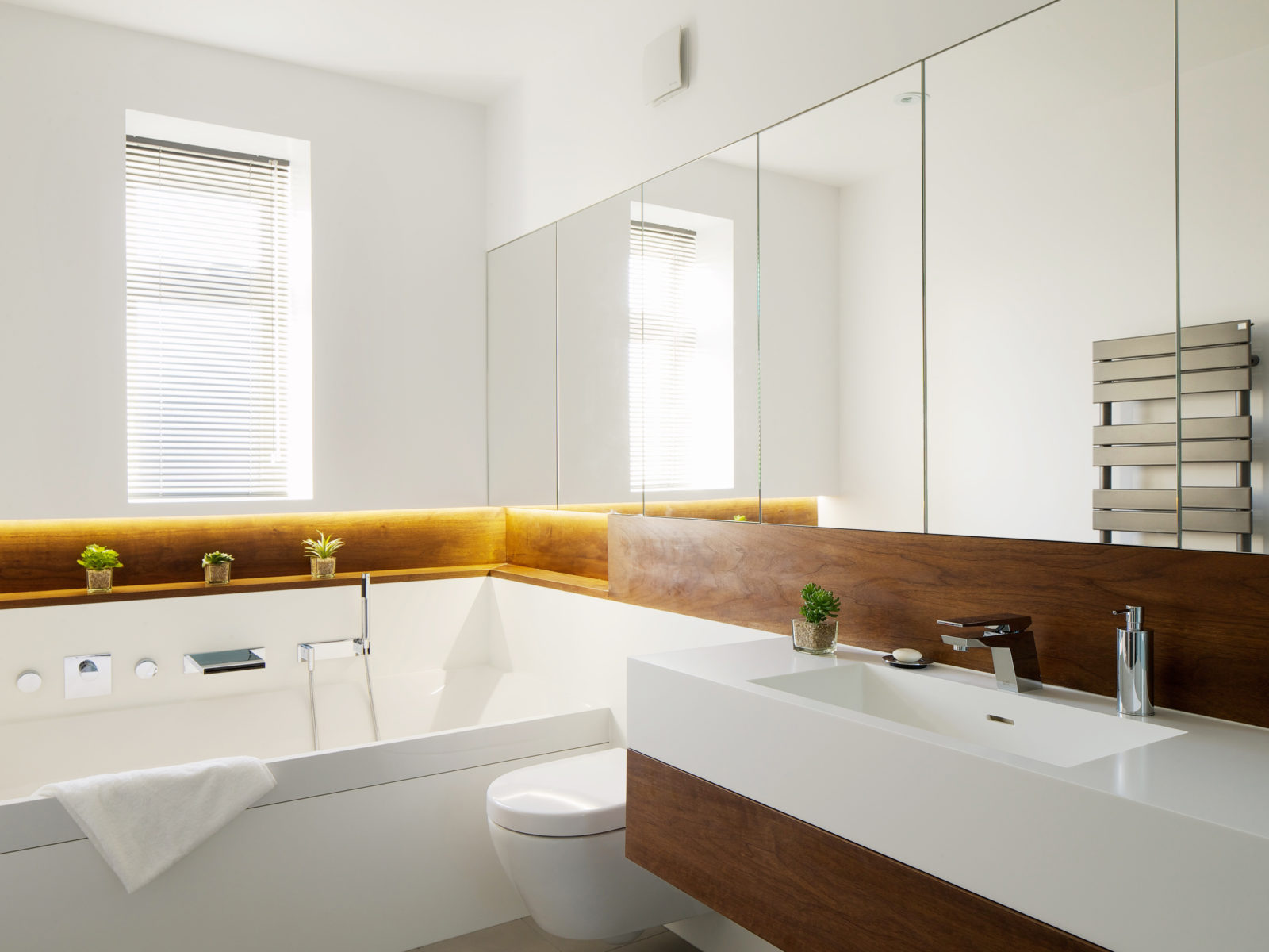 Bathroom with Corian and walnut vanity unit