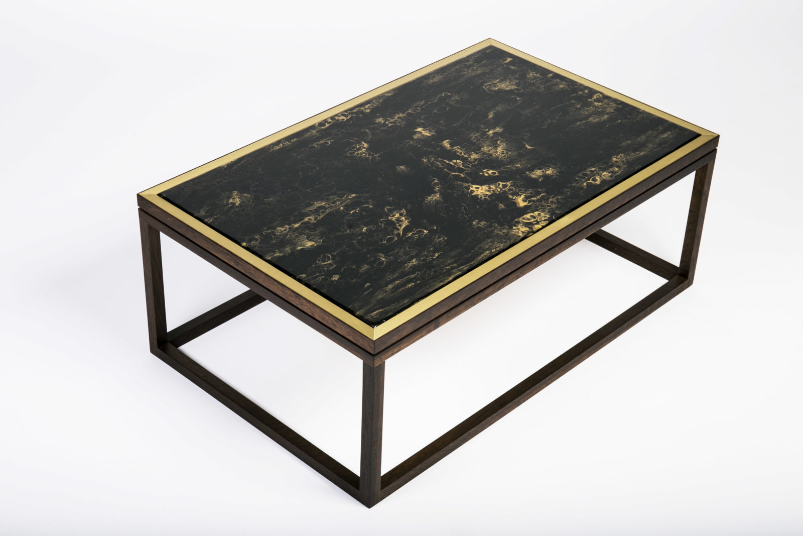 Gold and black painted coffee table with satin brass border and fumed oak structure