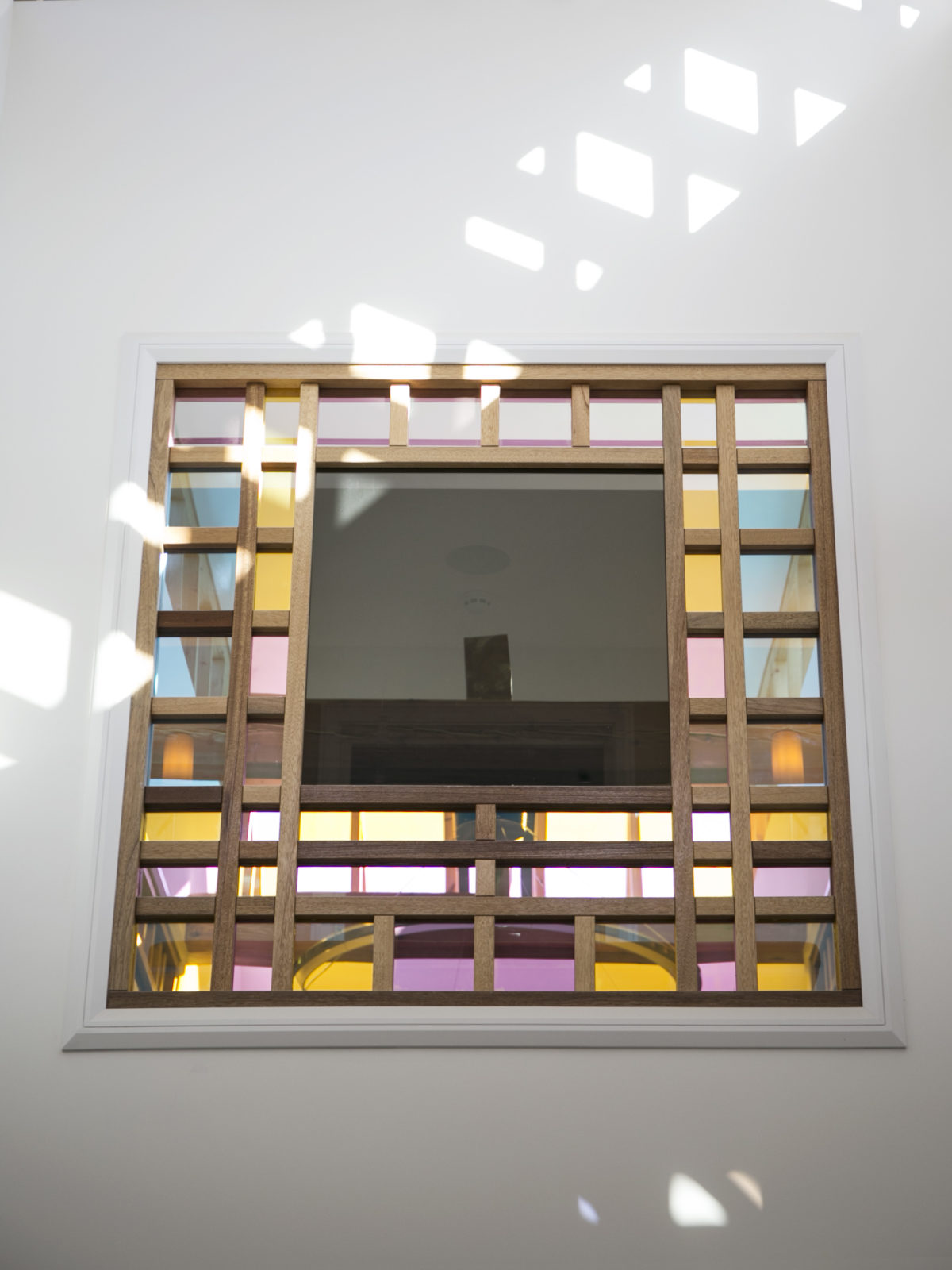 Dichroic glass window panel with meranti frame