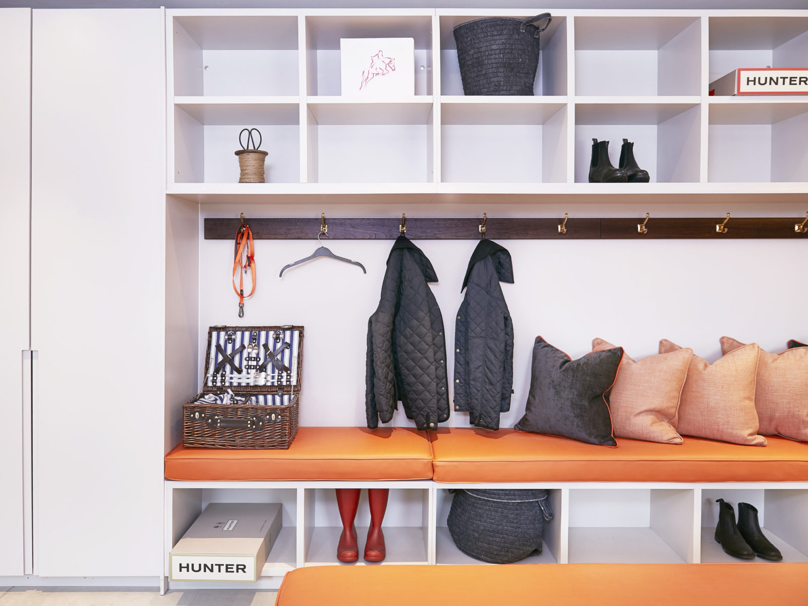 lacquered boot room open shelves with leather cushions