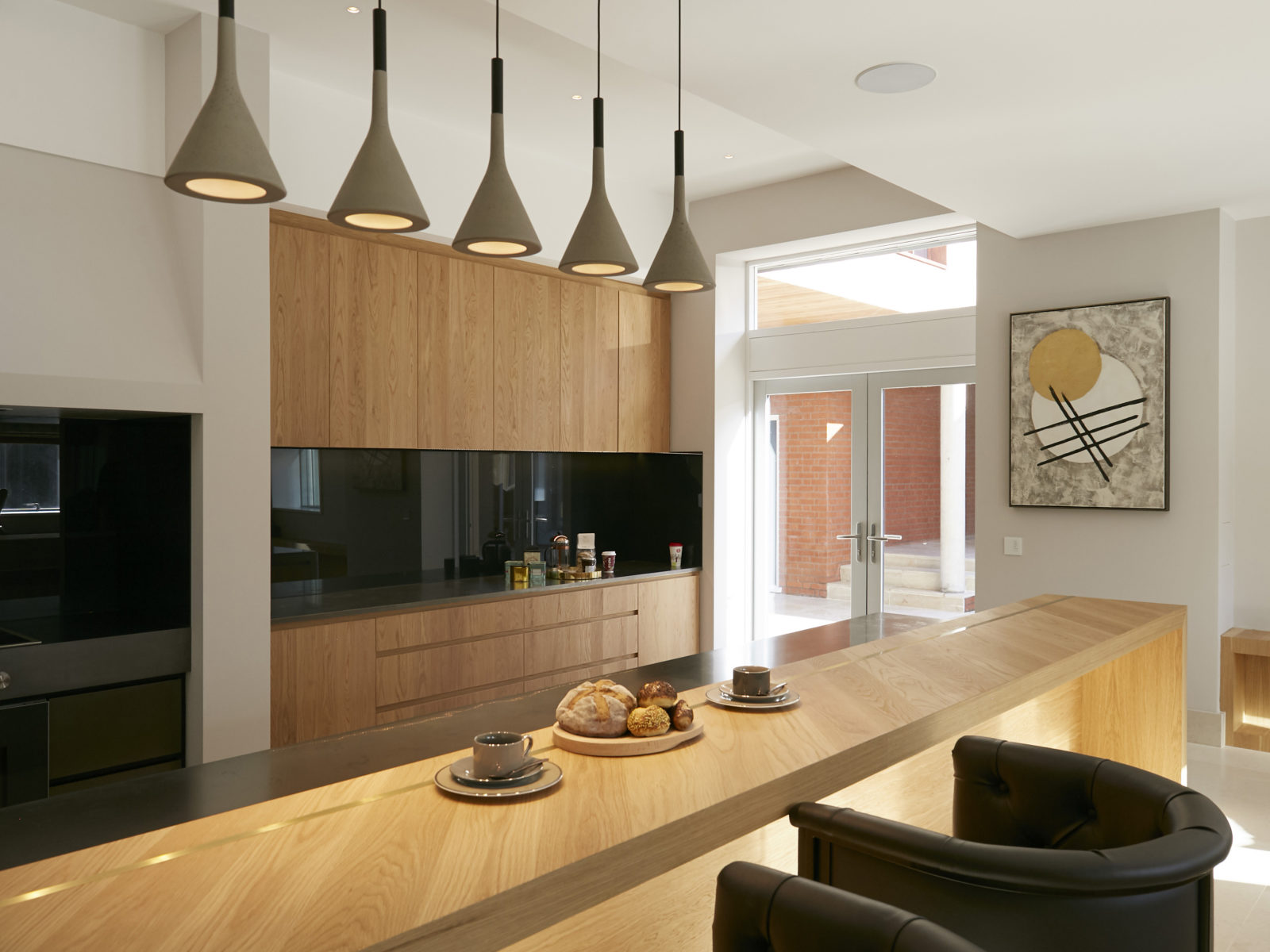 Oak cross grain veneer breakfast bar with satin brass inlay