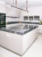 Matt lacquered kitchen island with thick Savana grey marble worktop