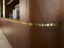 curved walnut veneer door and satin brass detail