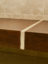 Walnut bench with marble inlay detail