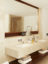 crema classic marble bathroom with walnut mirror frame