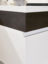 Corian handleless vanity unit with fumed oak strip detail