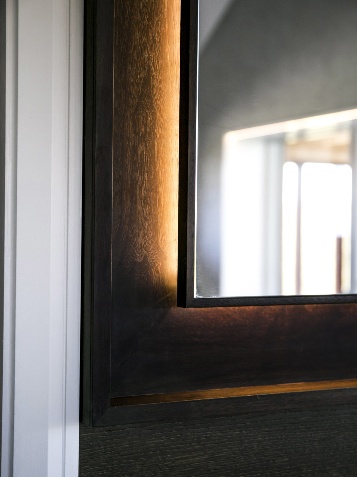 Fumed oak bathroom mirror with back lighting detail