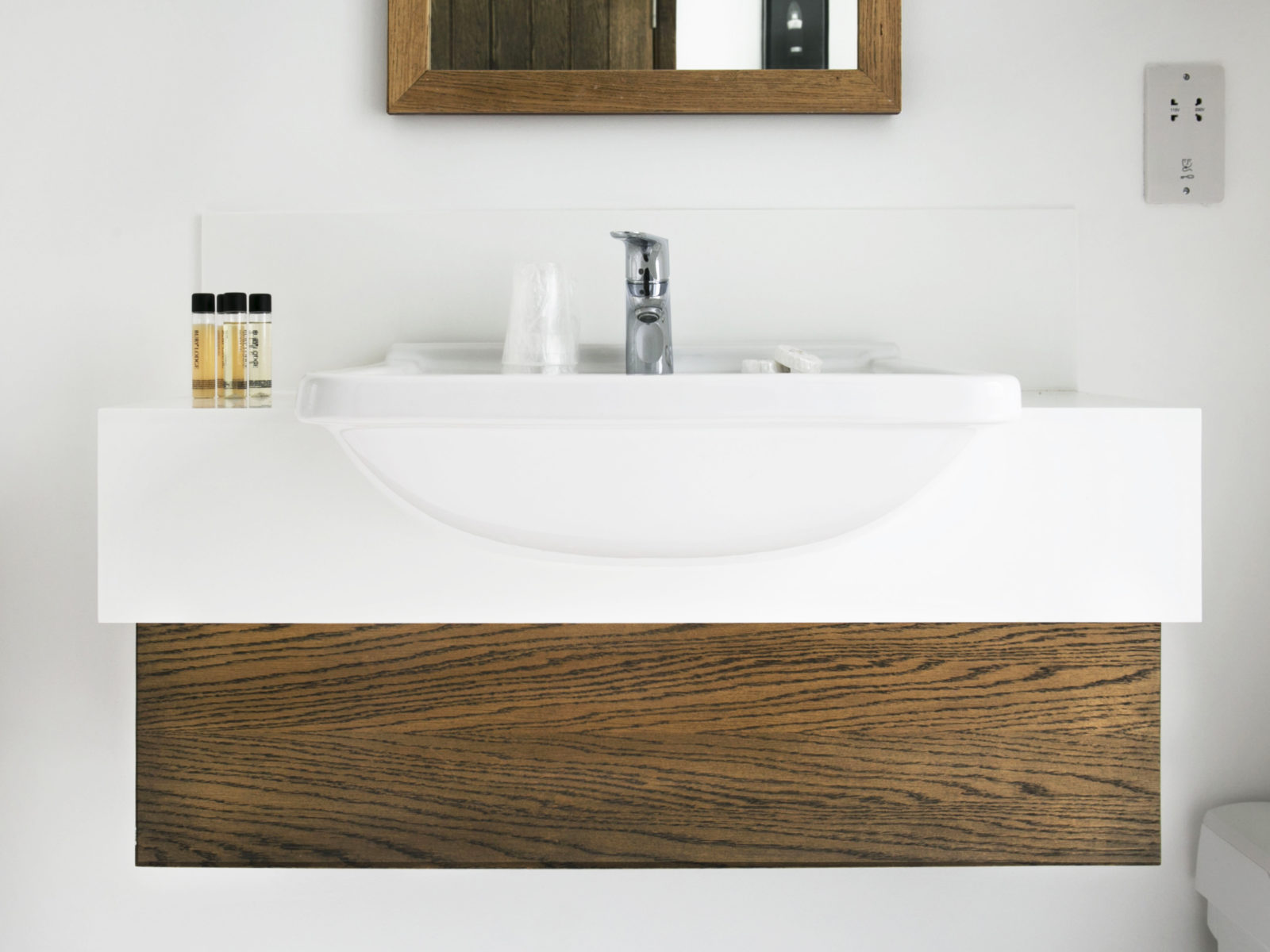 Oak vanity unit with Corian worktop and built-in sink