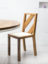 Solid teak chair with teak back strips and fabric seat