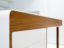 curved Corian desk with walnut venner details
