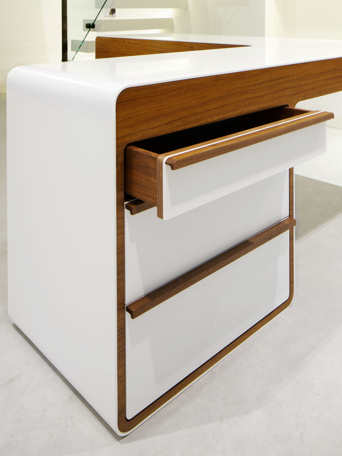 Corian desk with walnut drawer handle