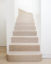 Limed oak staircase with rose gold inlay