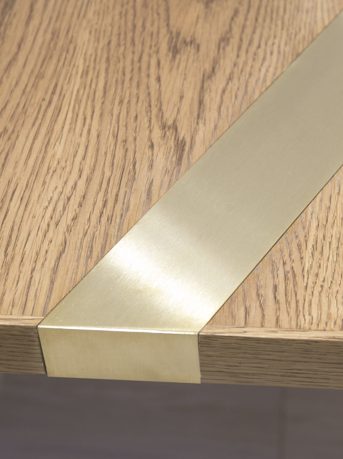 oak with satin brass inlay detail