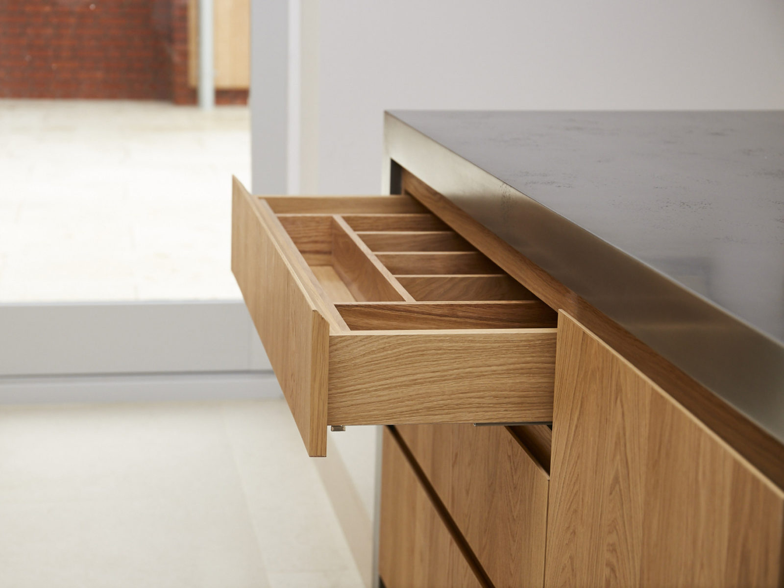 Handless solid oak drawer with internal partition