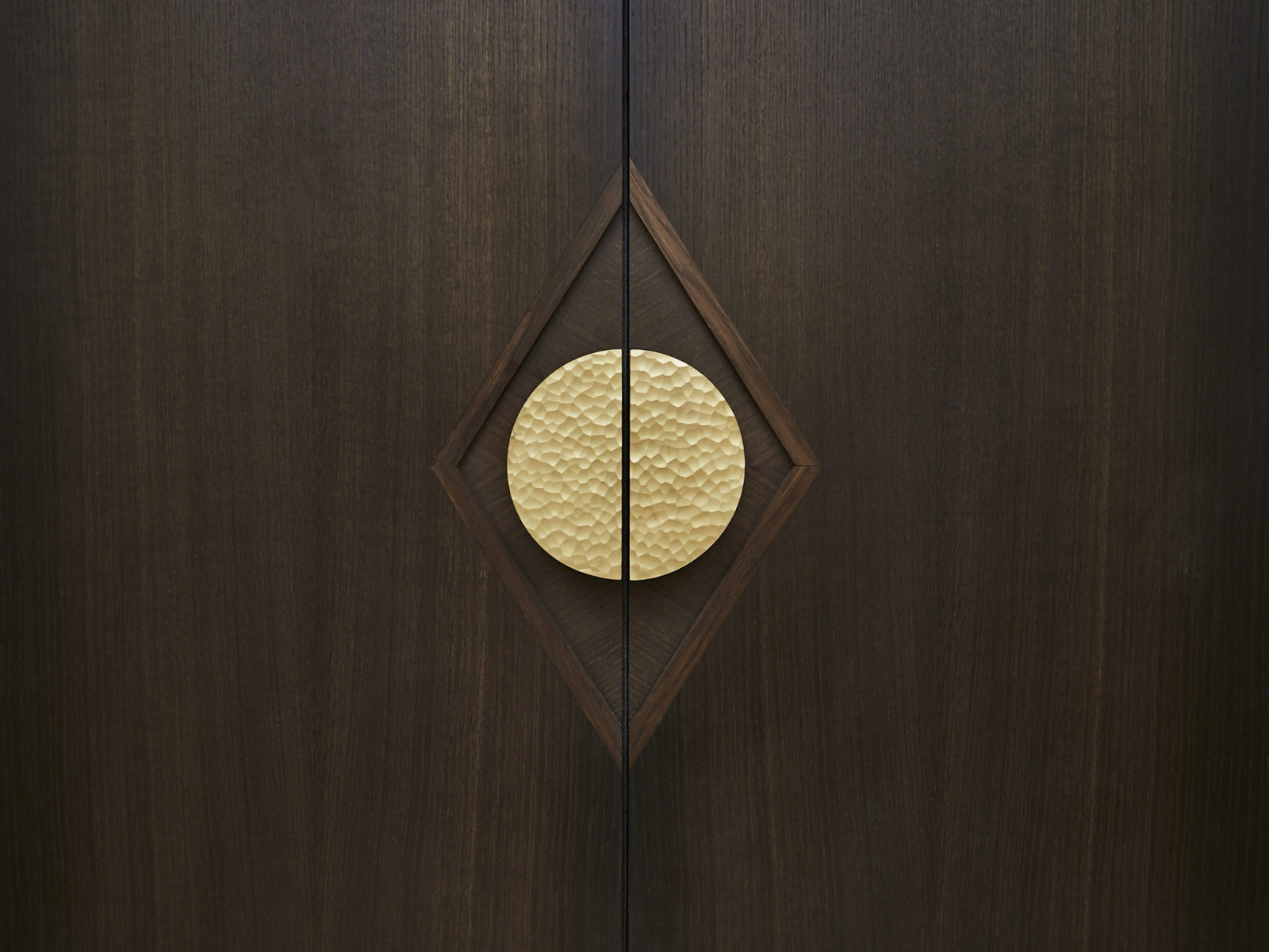 Bespoke fumed oak door with diamond motif and Ged Kennet handle