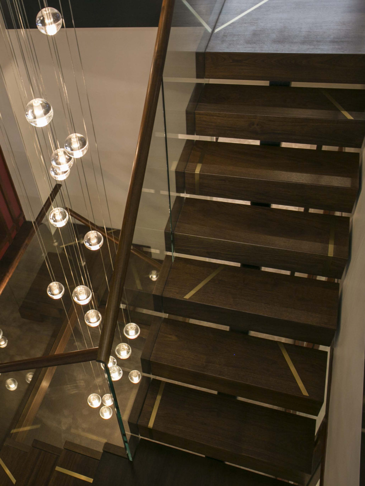Solid walnut staircase with Bocci feature lights
